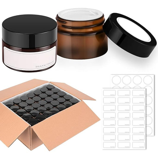 1 oz Amber Glass Jars with Lids, 105 pack Clear Small Jars with Black Lids, White Labels and Inner Liners, Empty Round Cosmetic Containers for Cream, Lotion (Amber 105 Pack)