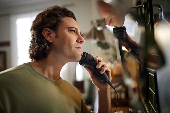 Philips Norelco Shaver 1100 Series, Dry Electric Shaver, 27 Self-Sharpening ComfortCut Blades, 4D Floating Heads, P-Cap, Deep Black, Model S1016/90